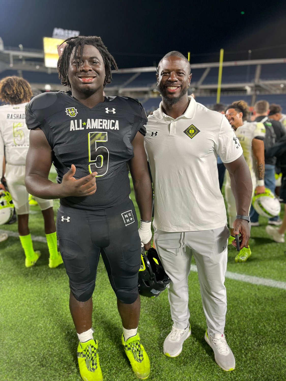 David Hicks Sr. and D.J. Hicks pose for a photo during the Under Armour All-American game.